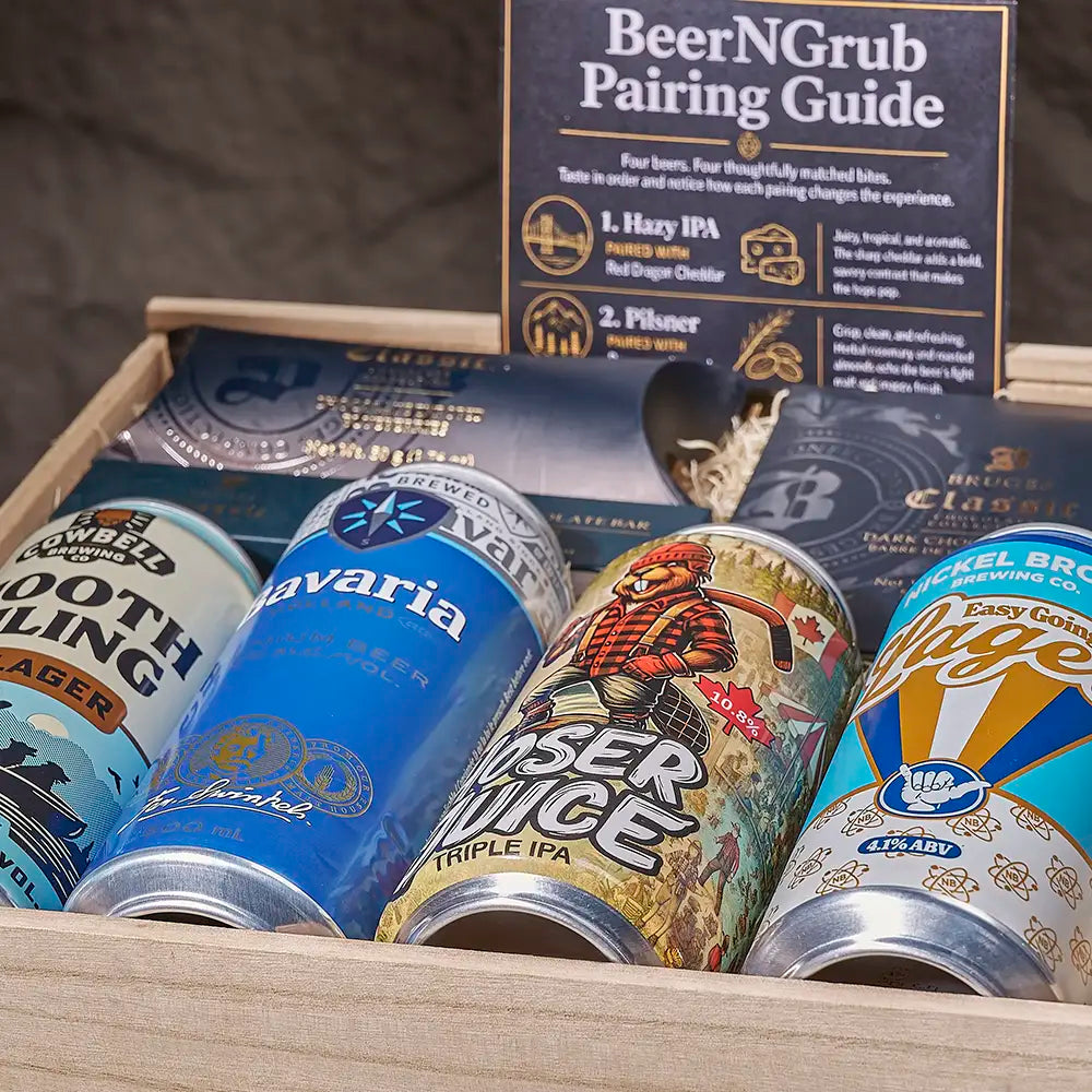 A wooden gift box filled with craft beer cans and a 'BeerNGrub Pairing Guide' booklet. Visible cans include Smoother Stout, Bavaria, Lager Juice Triple IPA, and Ice Age Easy Gold IPA.