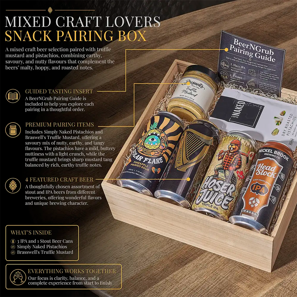 A wooden gift box labeled 'Mixed Craft Lovers Snack Pairing Box' filled with curated beer snacks and accessories. Visible items include a BeerGrub pairing guide, a 'Beer with Us' card, a 'Cuel Breiz' cheese stick, a 'Rustica' cheese stick, a 'Juice Lager' beer can, and a 'Beer & Brews' booklet.