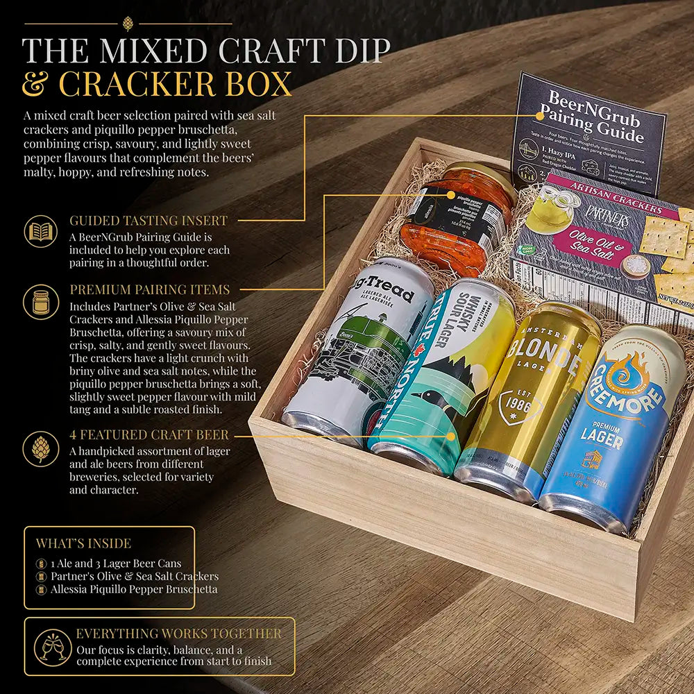 A wooden gift box labeled 'The Mixed Craft Dip &amp; Cracker Box' filled with assorted beer, cracker, and pairing items, photographed on a wooden tabletop. The box includes branded cans of Ale and Lager beers, a BeerGrub Pairing Guide, and promotional callouts with text describing the contents and pairing features.