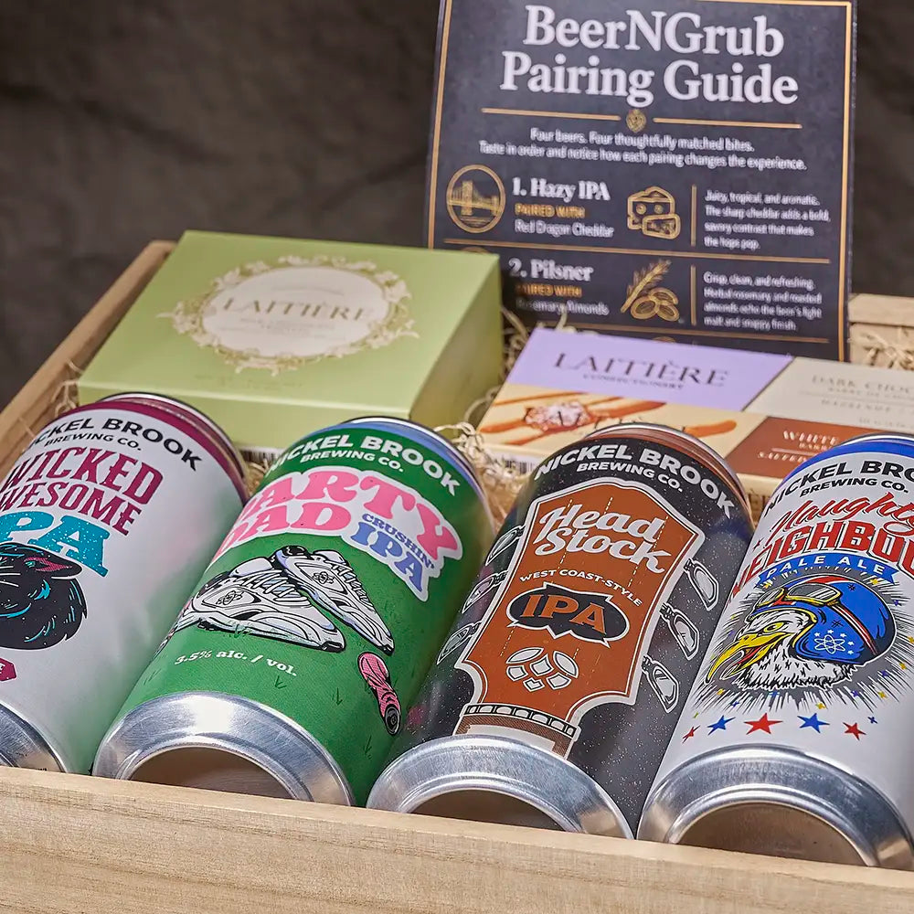 A curated beer gift set in a wooden box featuring four different craft beer cans from Nickel Brook Brewing Company, a green Lattiere gift box, and a 'BeerNGrub Pairing Guide' booklet.